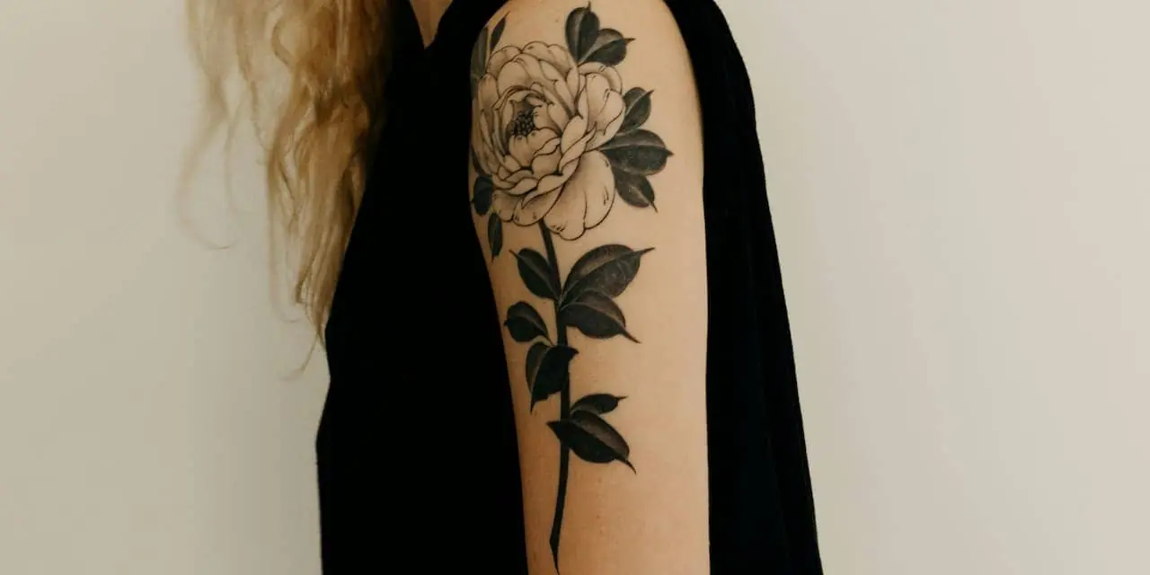 A dark shaded floral tattoo