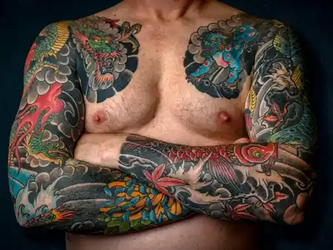 A full sleeve and chest tattoo