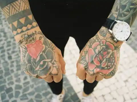 An intricate hand and wrist tattoo