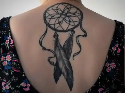 A dreamcatcher back tattoo