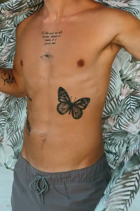 A butterfly tattoo on the stomach