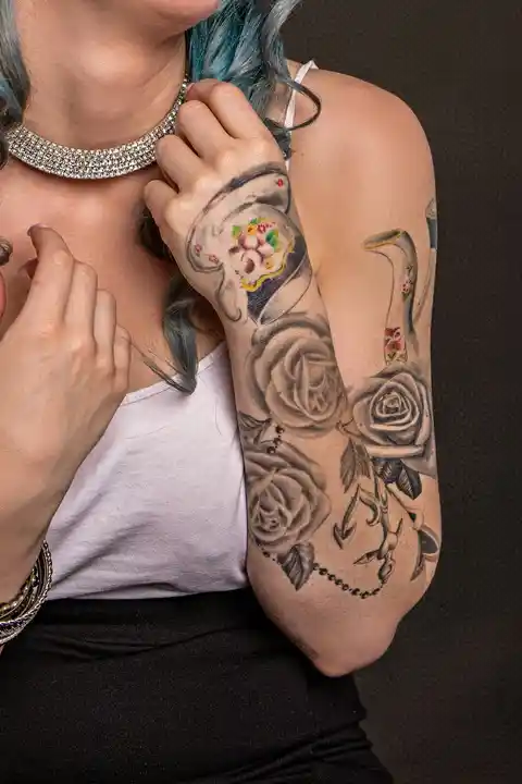 A tattoo of flowers on the arm