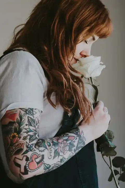 A tattoo of flowers down a woman's arm