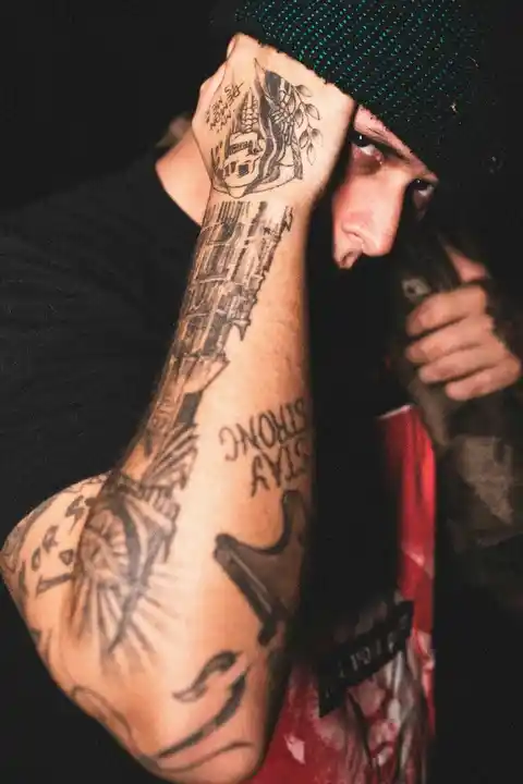 Many tattoos on a forearm