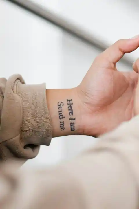 A tattoo on a person's wrist