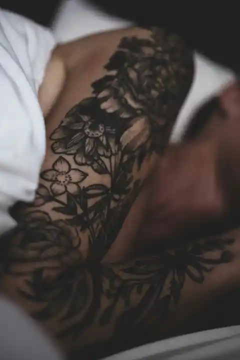 A floral sleeve tattoo