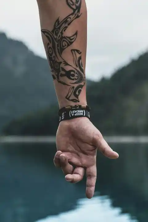 A patterned forearm tattoo