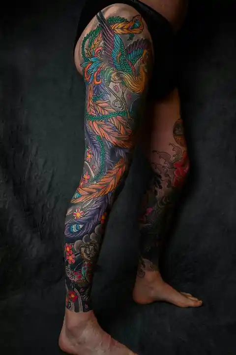 A colourful full leg tattoo