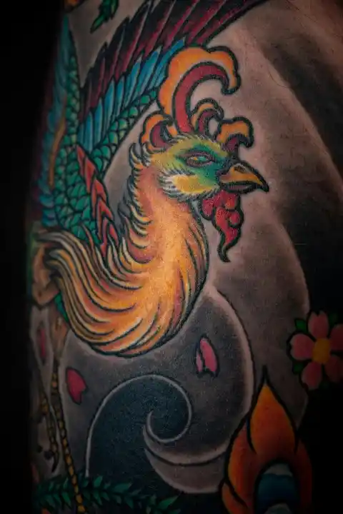 A colourful ancient bird tattoo