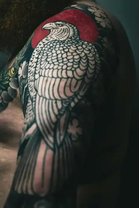 A bird tattoo on the shoulder