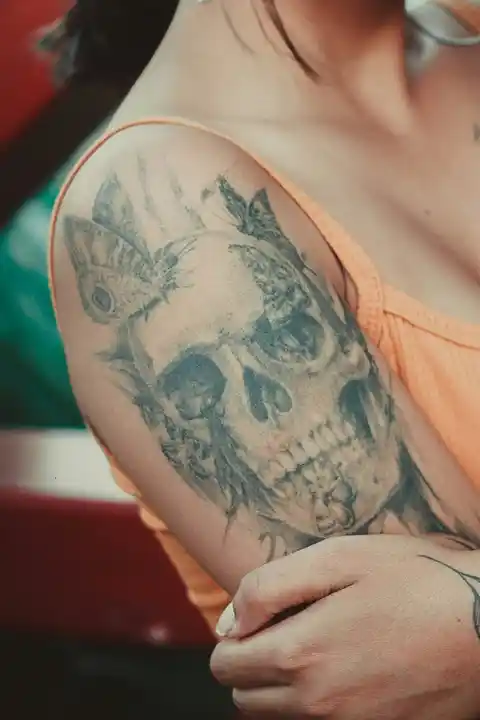 A tattoo of a skull on the shoulder