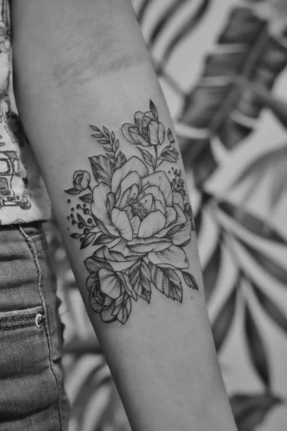 A floral forearm tattoo